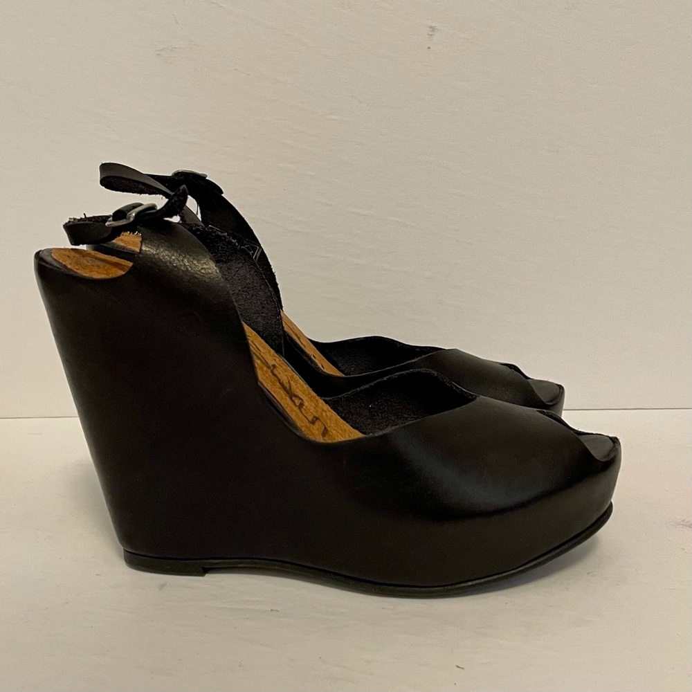 Sixtyseven leather wedges with peep toe.